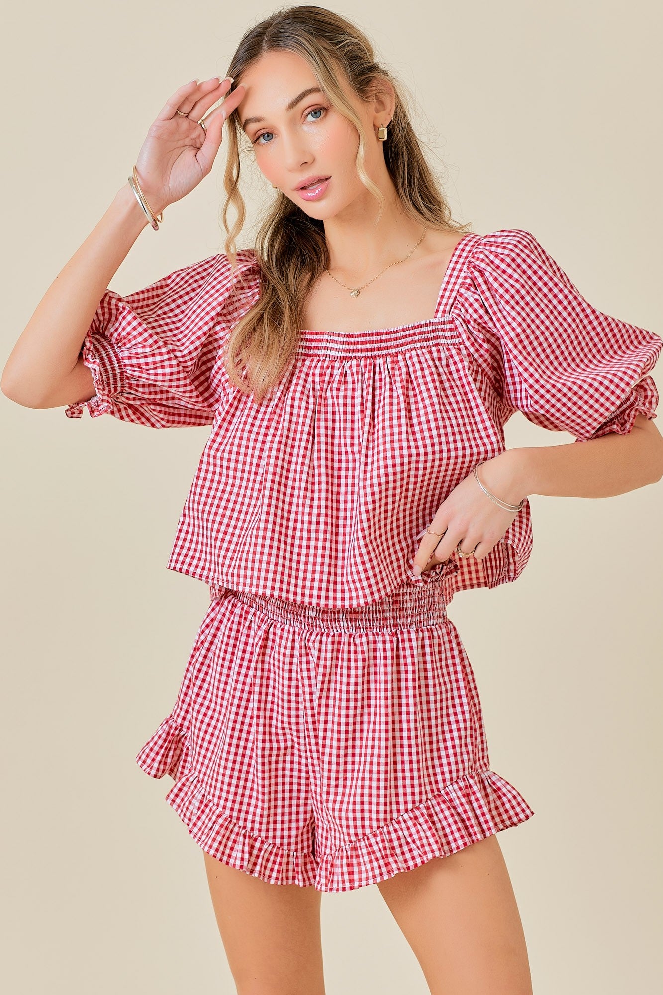 MALLIE RUFFLE DETAIL SMOCKED GINGHAM SHORTS IN RED & WHITE