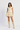 Woman wearing a floral dress with beige cowboy boots on a white background