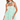 Woman wearing a light green dress with ruffled layers on a white background