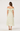Woman wearing a floral off-shoulder dress on a white background
