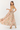 Woman wearing a floral dress on a white background