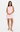 Woman wearing a light pink dress on a white background