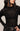 Black patterned sweater worn by a person on a neutral background