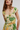 Woman wearing a floral dress with a white background