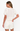 Woman wearing a white lace outfit on a white background