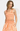 Woman wearing an orange and white checkered outfit on a plain background