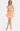 Woman wearing an orange and white checkered dress on a white background