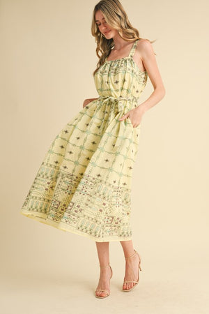 ELISE SMOCKED MIDI DRESS IN LEMON DROP