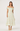 Woman wearing a floral off-shoulder dress on a white background