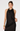 A woman modeling a black satin halter dress with black lace trim at the neckline and hem, set against a plain light gray studio background.