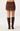 A model shown from the back wearing a brown suede mini skirt and matching brown over-the-knee boots against a light gray studio background.