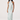 Woman wearing a light blue floral dress on a white background