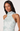Woman wearing a light blue floral dress against a plain background