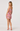 Woman wearing a floral dress on a white background