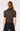 Rear view of a woman wearing a short-sleeve ribbed knit polo shirt with horizontal brown, black, and beige stripes, paired with dark navy pants, against a light gray studio background.
