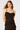 A woman modeling a dark brown ruffled spaghetti-strap dress against a plain light gray studio background.