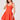 Woman wearing a red dress on a white background