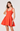 Woman wearing a red dress on a white background