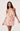 Woman wearing a floral dress on a white background