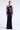 Woman wearing a one-shoulder purple sequin gown on a white background