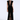 A woman modeling a sleeveless black velvet floor-length gown with a plunging V-neckline, sheer mesh panel at the neckline, and a high front slit, photographed against a light gray studio background.