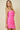 Woman wearing a pink strapless dress with white stripes on a beige background