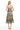 Woman wearing a strapless floral dress on a white background