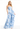 Woman wearing a strapless blue floral dress on a white background