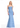 Woman wearing a strapless blue evening gown on a white background