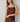 Woman wearing a satin cami in rum raisin