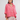Woman wearing a linen oversized top in tart berry.