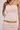 Pastel striped dress worn by a model on a plain background