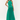 Woman wearing a green dress on a white background