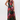 Woman wearing a floral one shoulder gown by hutch.