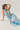 Woman wearing a floral dress on a white background
