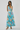 Woman wearing a floral dress on a white background