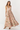 Woman wearing a floral dress on a white background