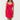 Woman wearing a pink dress with ruffled details on a white background