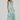 Woman wearing a floral dress on a white background