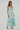 Woman wearing a floral dress on a white background