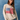 Woman wearing a beige sweater with an American flag design against a blue background