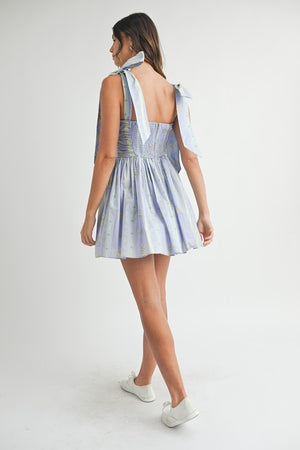 FLORAL RUCHED MINI DRESS WITH SHOULDER TIE IN LAVENDER