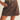 A model wearing a dark brown denim mini skirt with a button closure and belt loops, paired with an olive green ribbed top, shown against a light beige background.