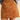 A close-up of a model wearing a tan faux-suede A-line mini skirt paired with a light blue knit sweater, shown from the waist down against a solid light beige background.