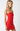 Woman wearing a strapless red dress against a white background