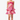 Woman wearing a pink floral dress on a white background