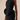 Black dress with a large floral detail on a beige background