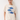 Woman wearing a cream t-shirt with blue fish graphics on a white background