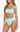 Woman wearing a light blue bikini set on a white background