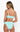 Woman wearing a light blue bikini against a white background